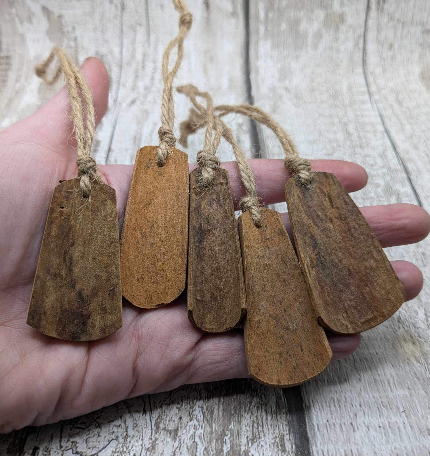 Plain Cinnamon bark shaped Christmas decorations.
