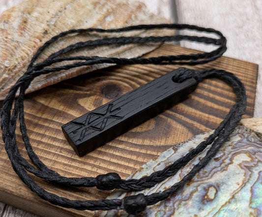 Fenland bog oak with protection bind rune pendant.