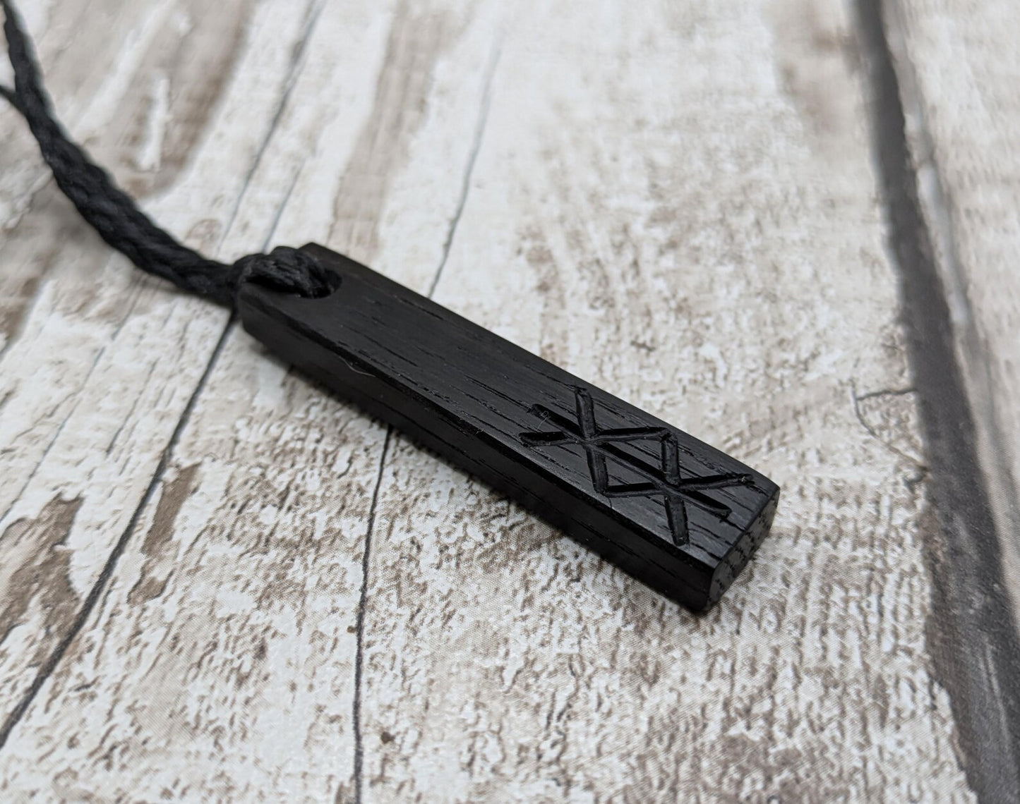 Fenland bog oak with protection bind rune pendant.