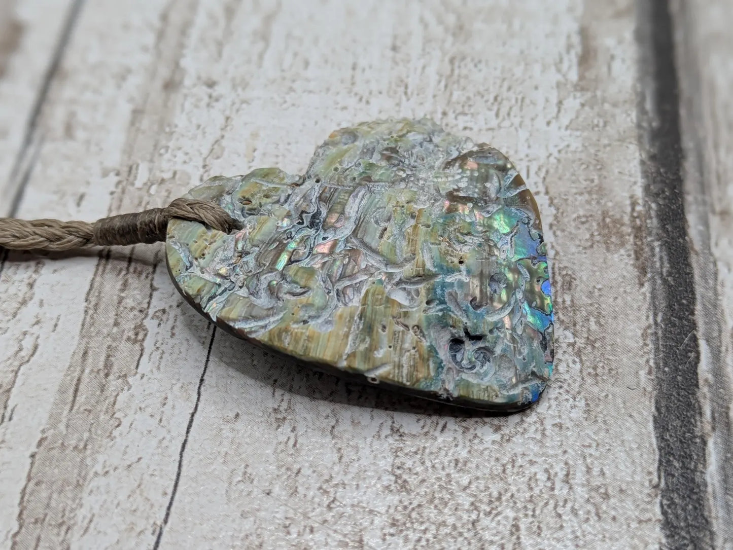 New Zealand rainbow Pāua abalone heart shaped pendant.