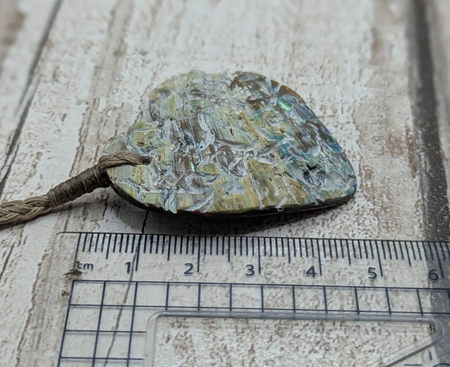 New Zealand rainbow Pāua abalone heart shaped pendant.