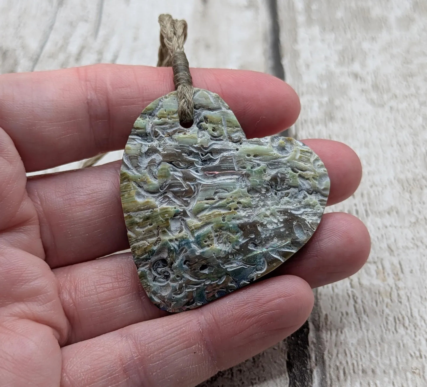 New Zealand rainbow Pāua abalone heart shaped pendant.