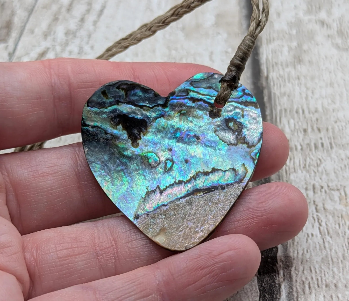 New Zealand rainbow Pāua abalone heart shaped pendant.