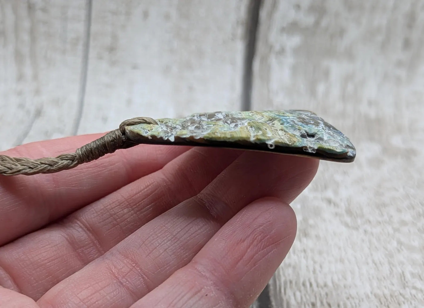 New Zealand rainbow Pāua abalone heart shaped pendant.