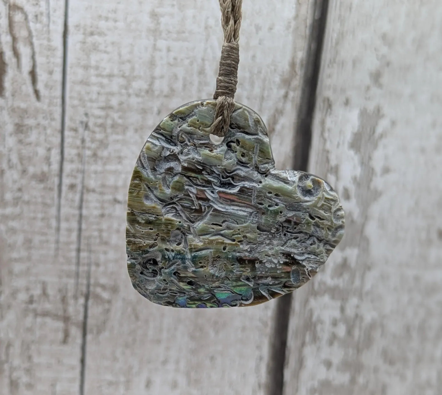 New Zealand rainbow Pāua abalone heart shaped pendant.
