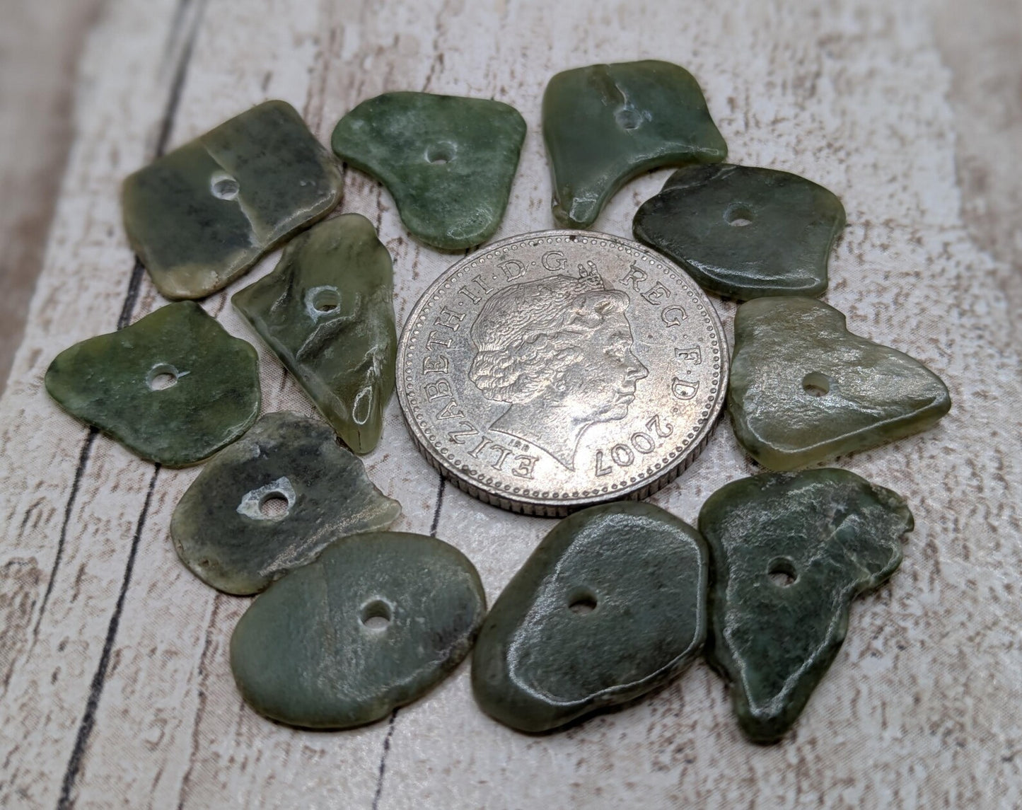 10 top drilled Pounamu greenstone jade beads.
