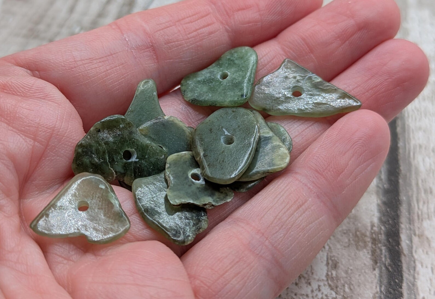 10 top drilled Pounamu greenstone jade beads.