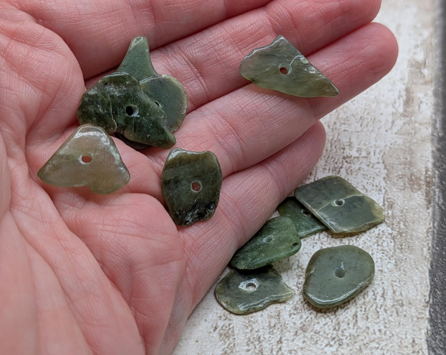 10 top drilled Pounamu greenstone jade beads.