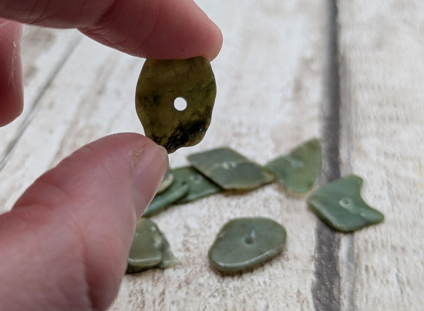 10 top drilled Pounamu greenstone jade beads.