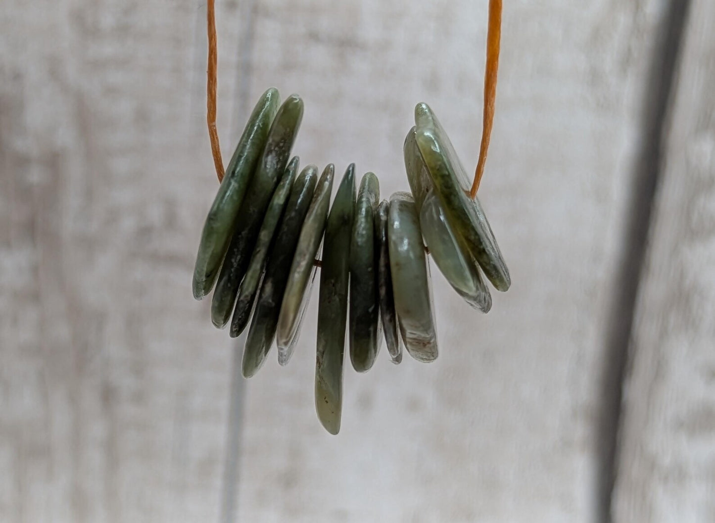 10 top drilled Pounamu greenstone jade beads.