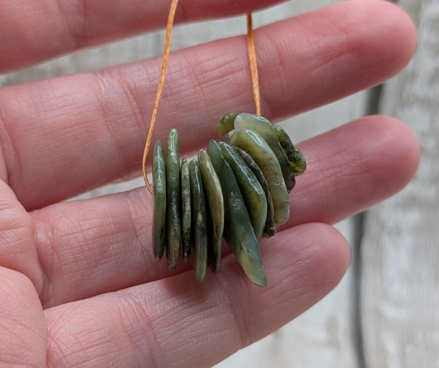 10 top drilled Pounamu greenstone jade beads.