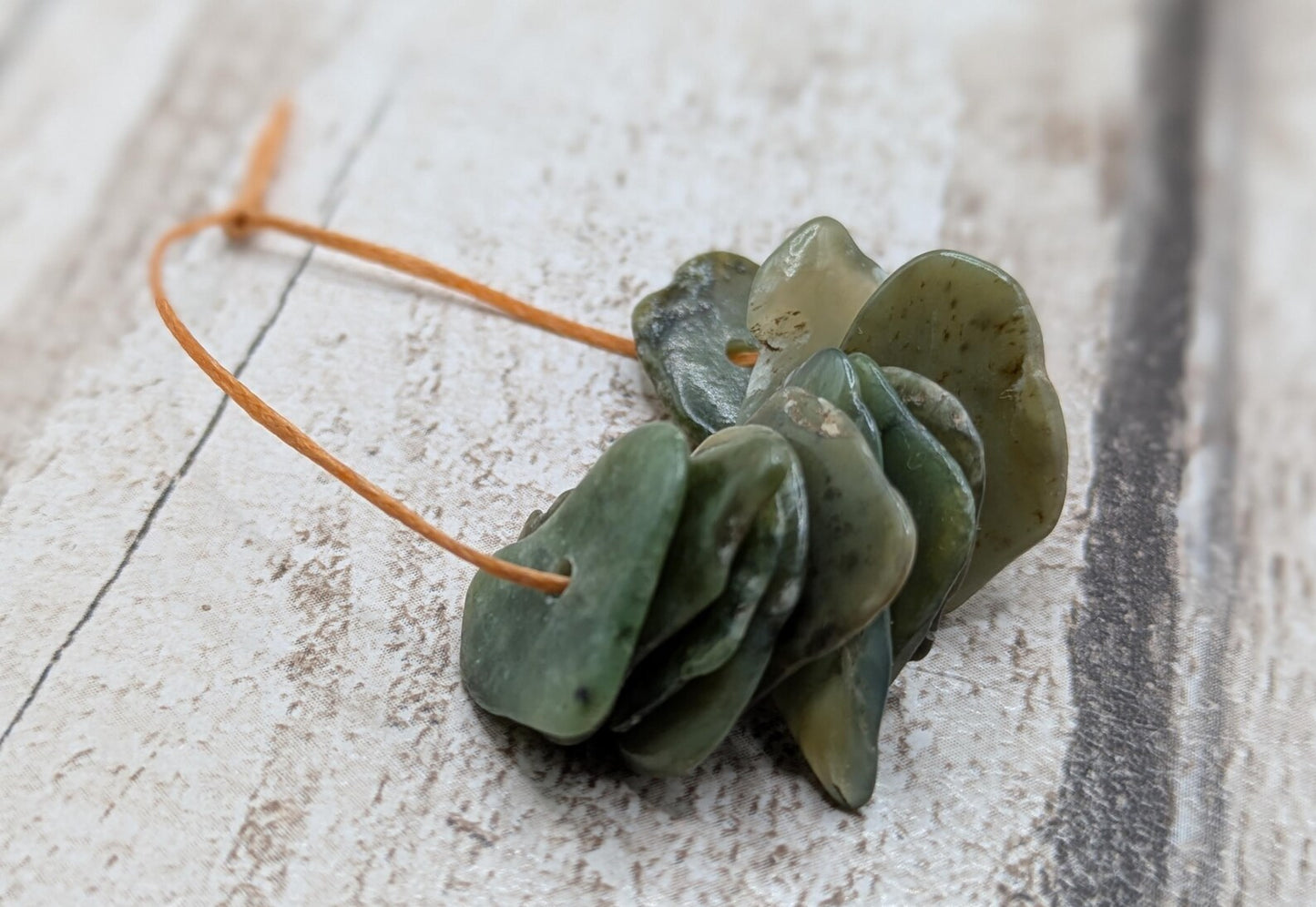 10 top drilled Pounamu greenstone jade beads.