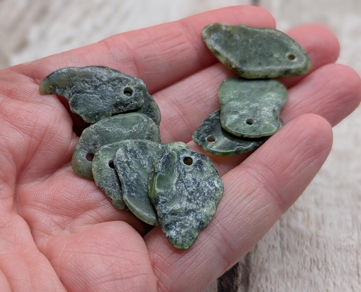 10 top drilled Pounamu greenstone jade beads.
