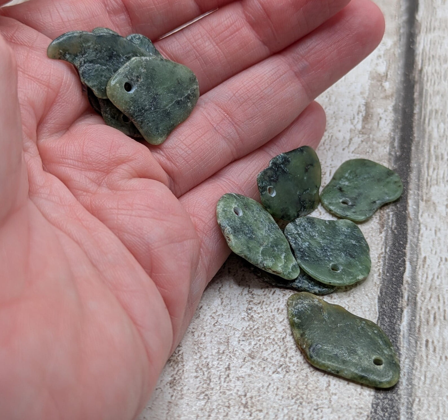 10 top drilled Pounamu greenstone jade beads.