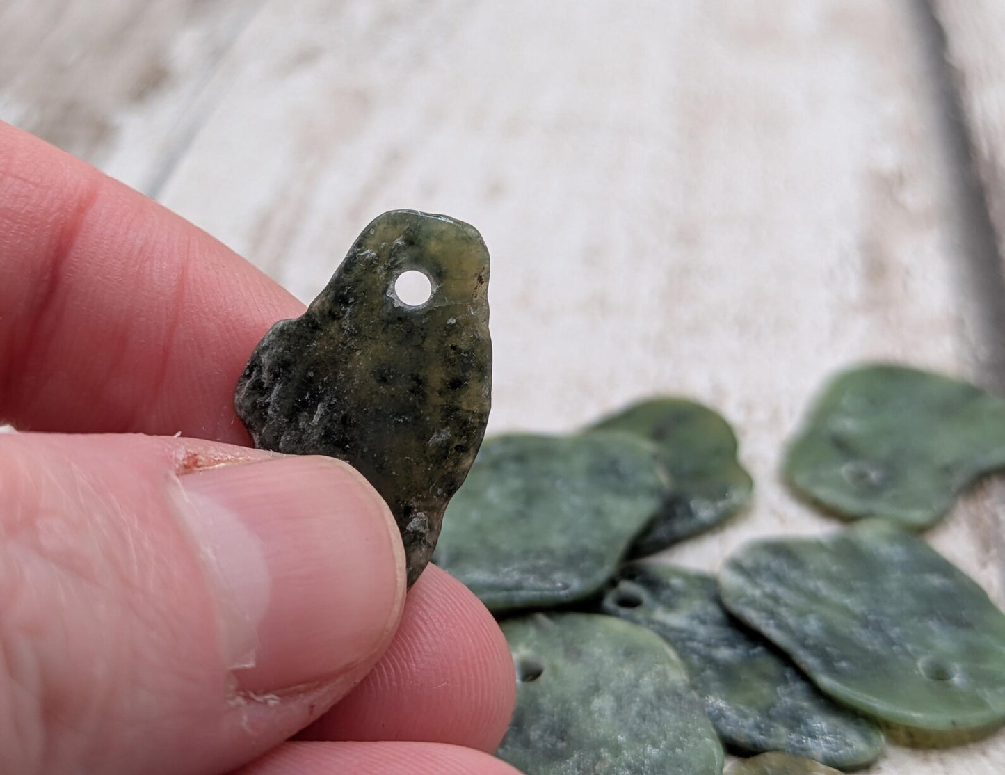 10 top drilled Pounamu greenstone jade beads.