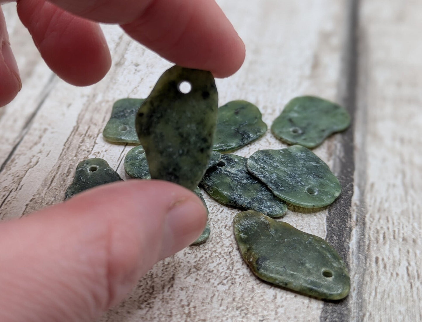 10 top drilled Pounamu greenstone jade beads.