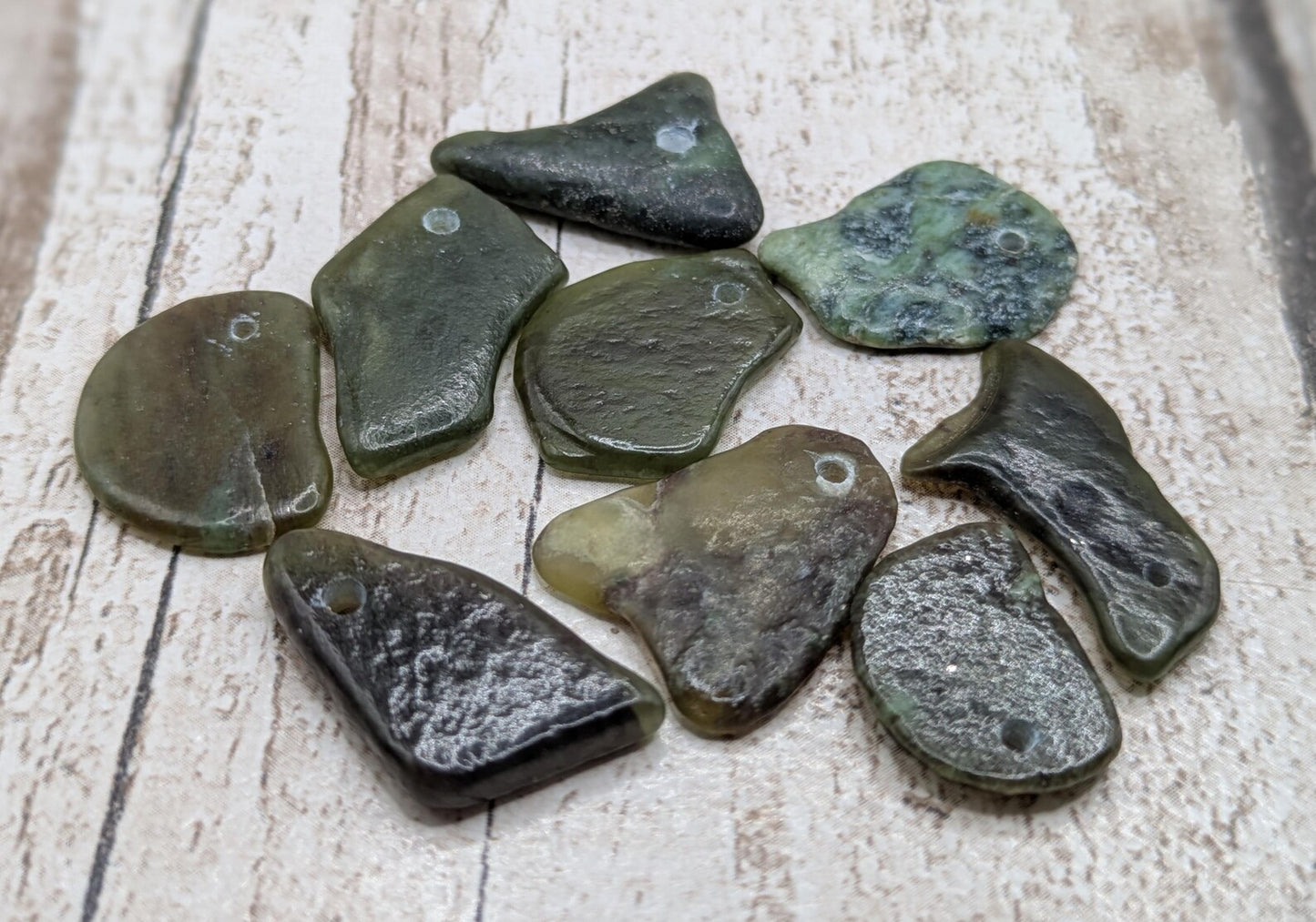 10 Pounamu greenstone jade beads.