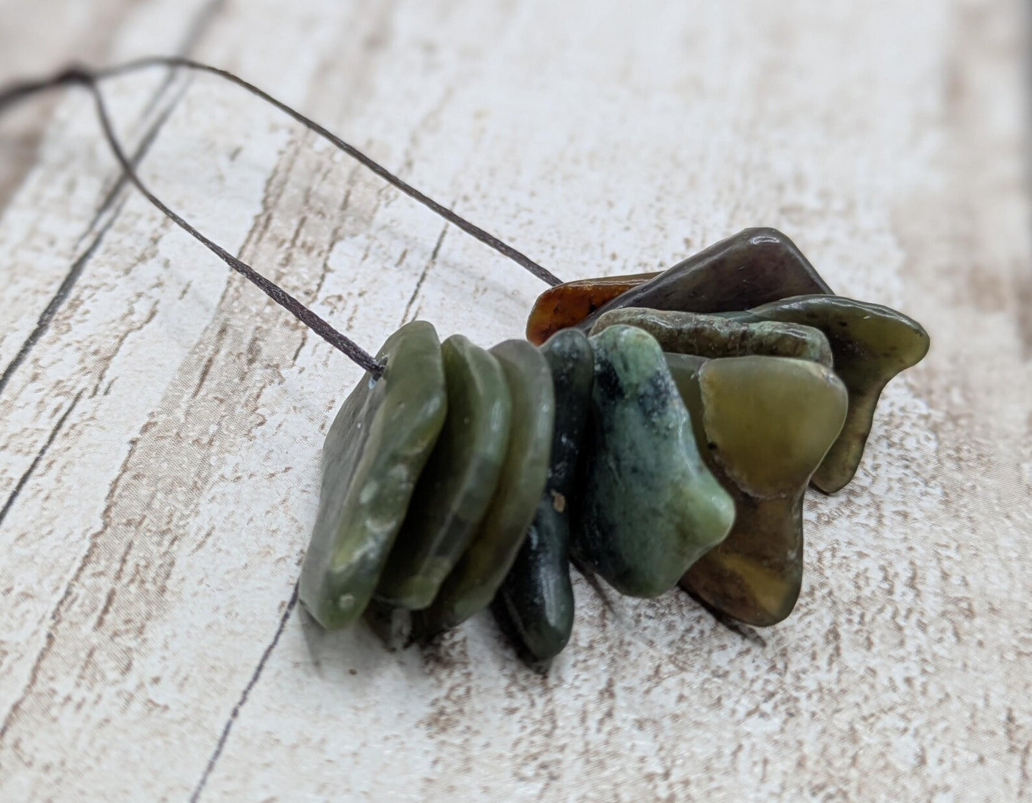 10 Pounamu greenstone jade beads.