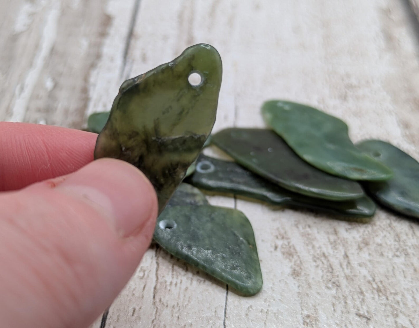 10 top drilled Pounamu greenstone jade beads.