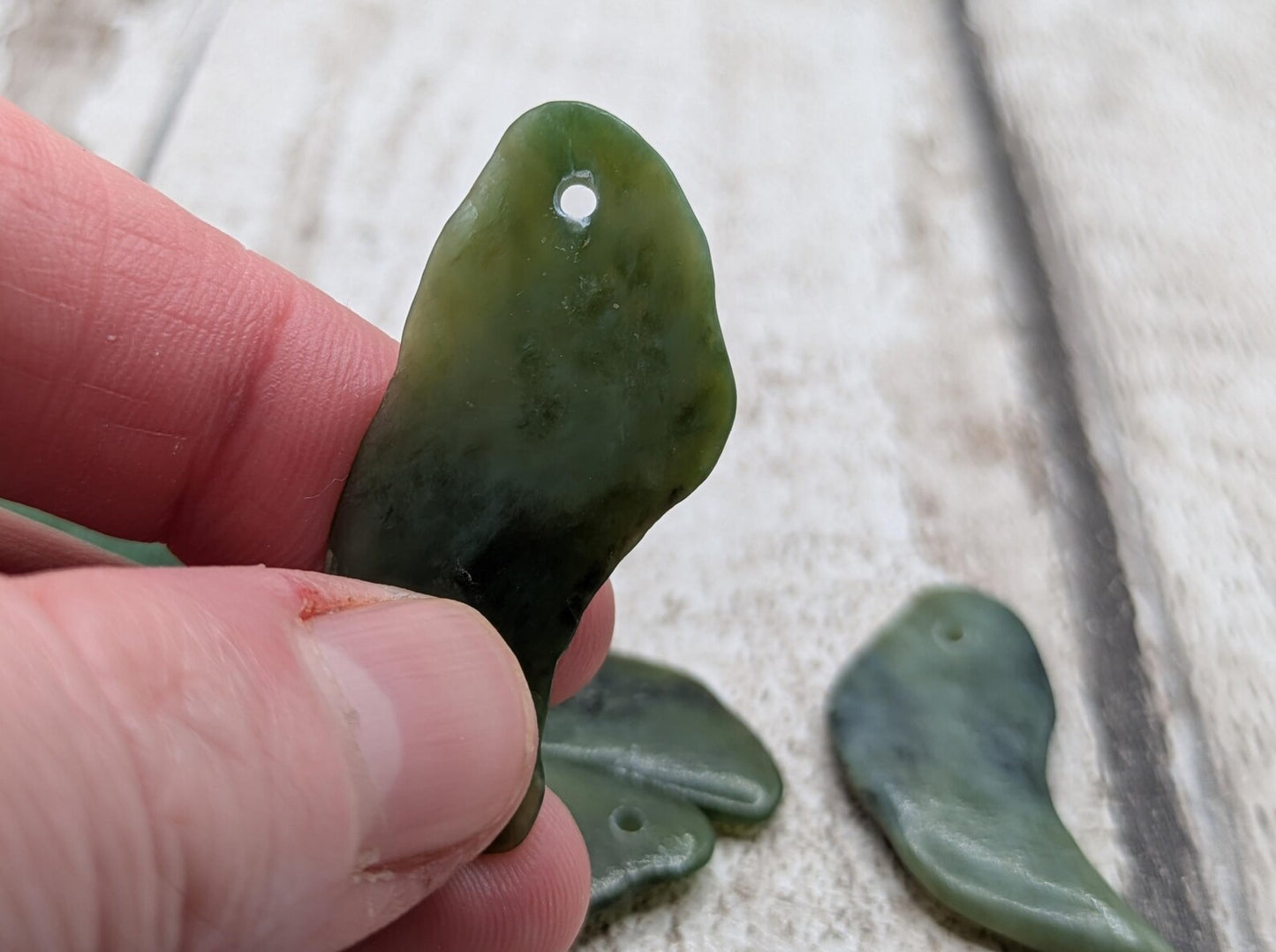 10 top drilled Pounamu greenstone jade beads.