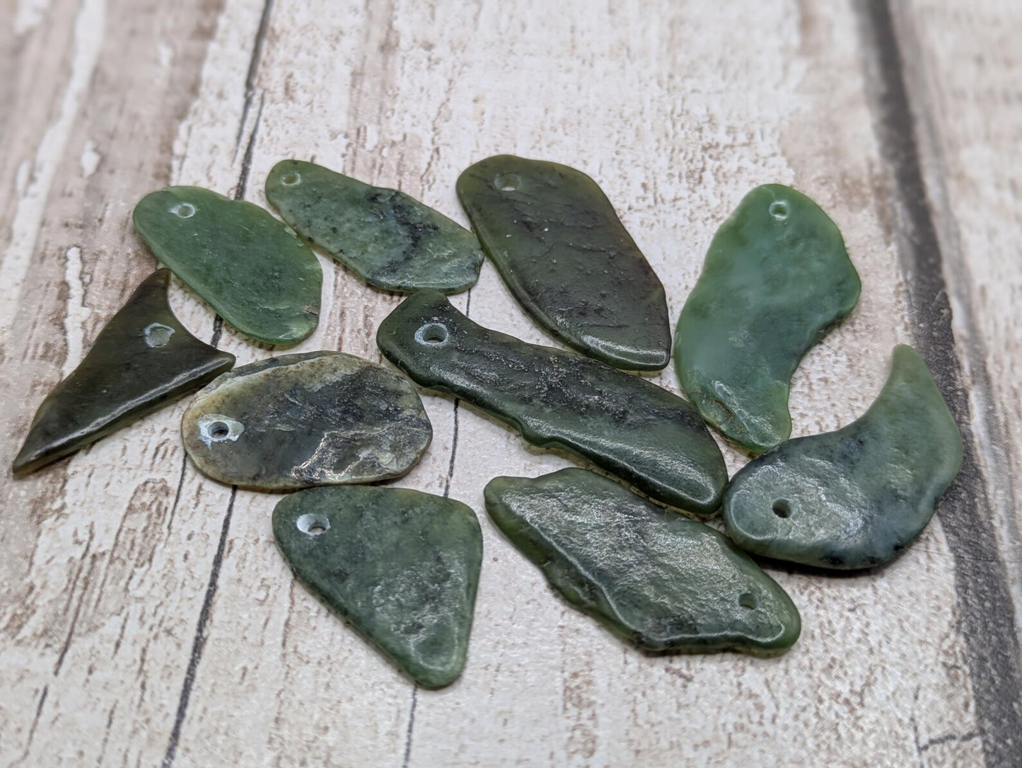 10 top drilled Pounamu greenstone jade beads.