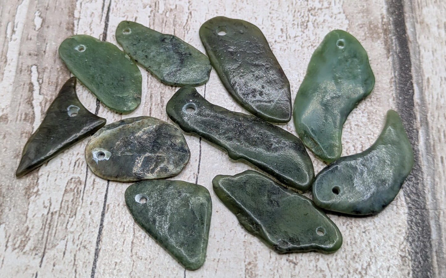 10 top drilled Pounamu greenstone jade beads.