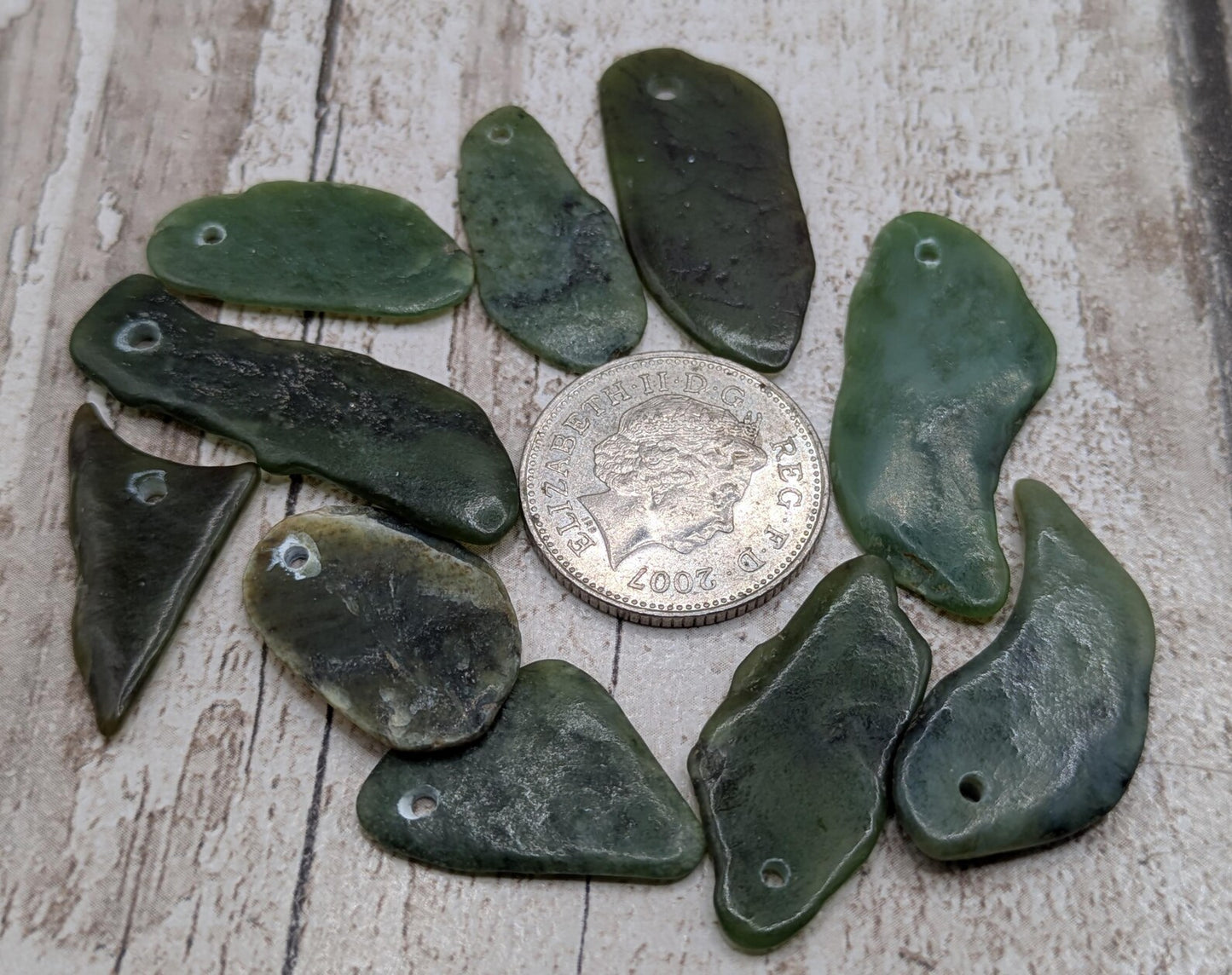 10 top drilled Pounamu greenstone jade beads.