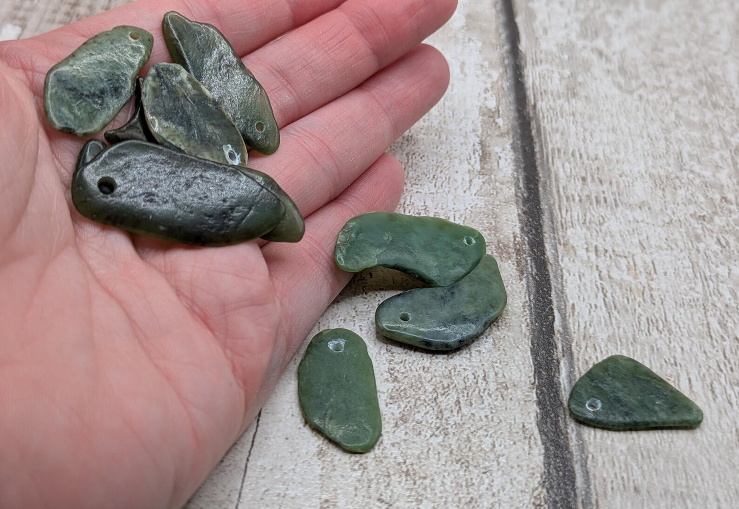 10 top drilled Pounamu greenstone jade beads.
