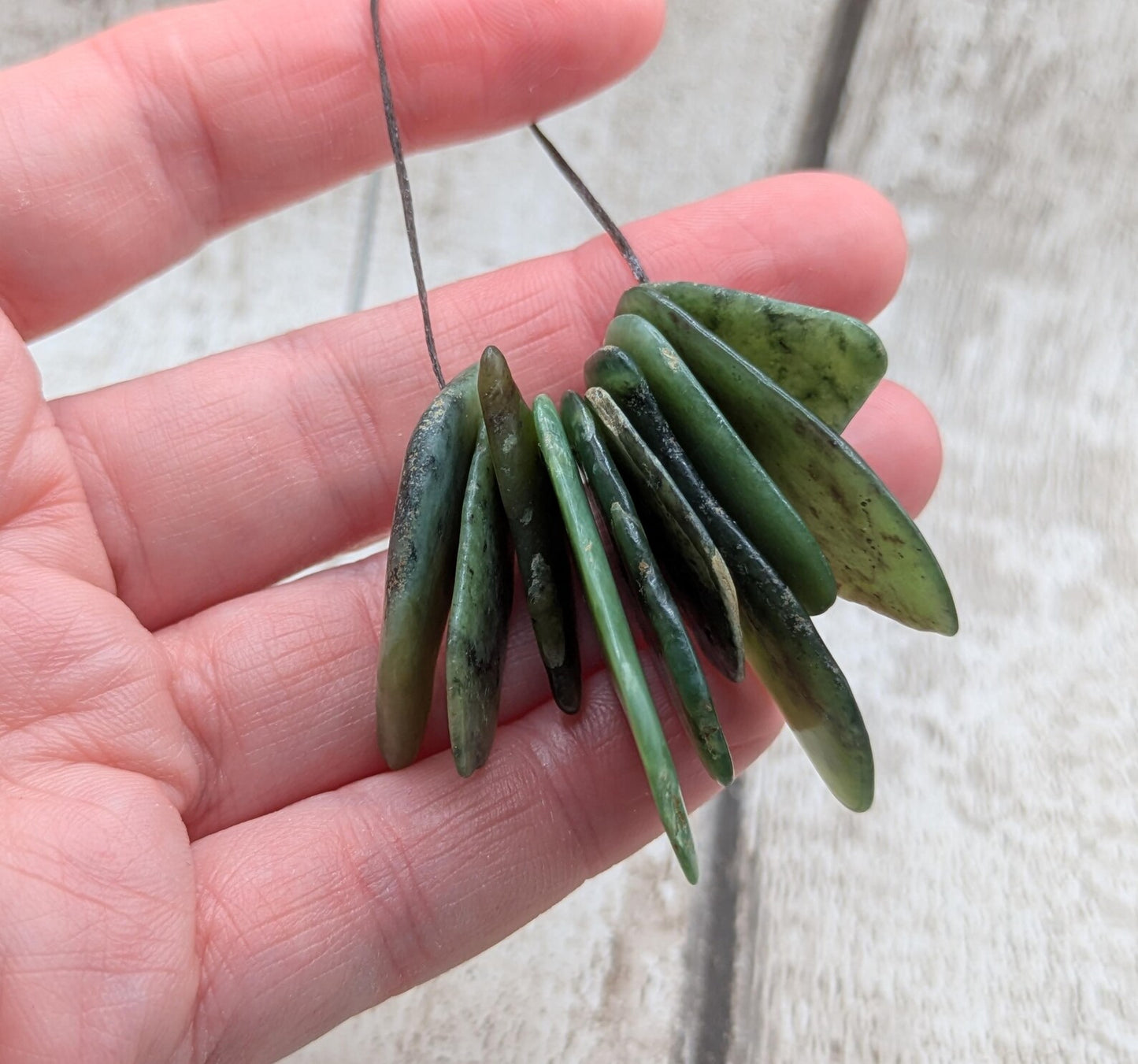 10 top drilled Pounamu greenstone jade beads.