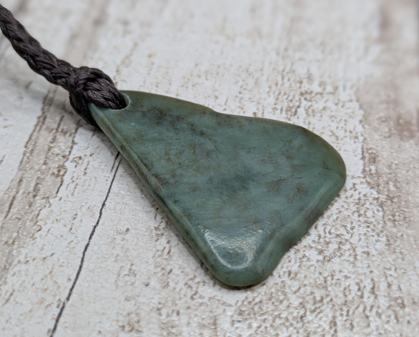 NZ Pounamu greenstone jade tumbled pendant.