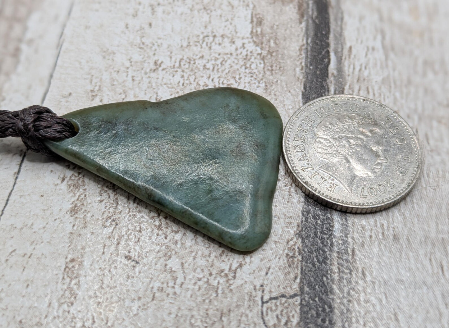 NZ Pounamu greenstone jade tumbled pendant.
