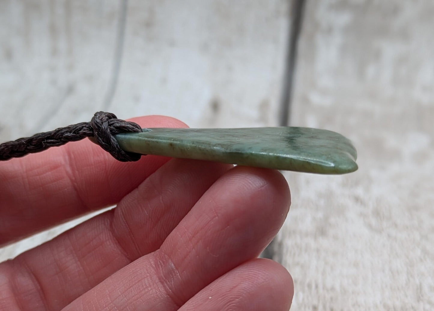NZ Pounamu greenstone jade tumbled pendant.