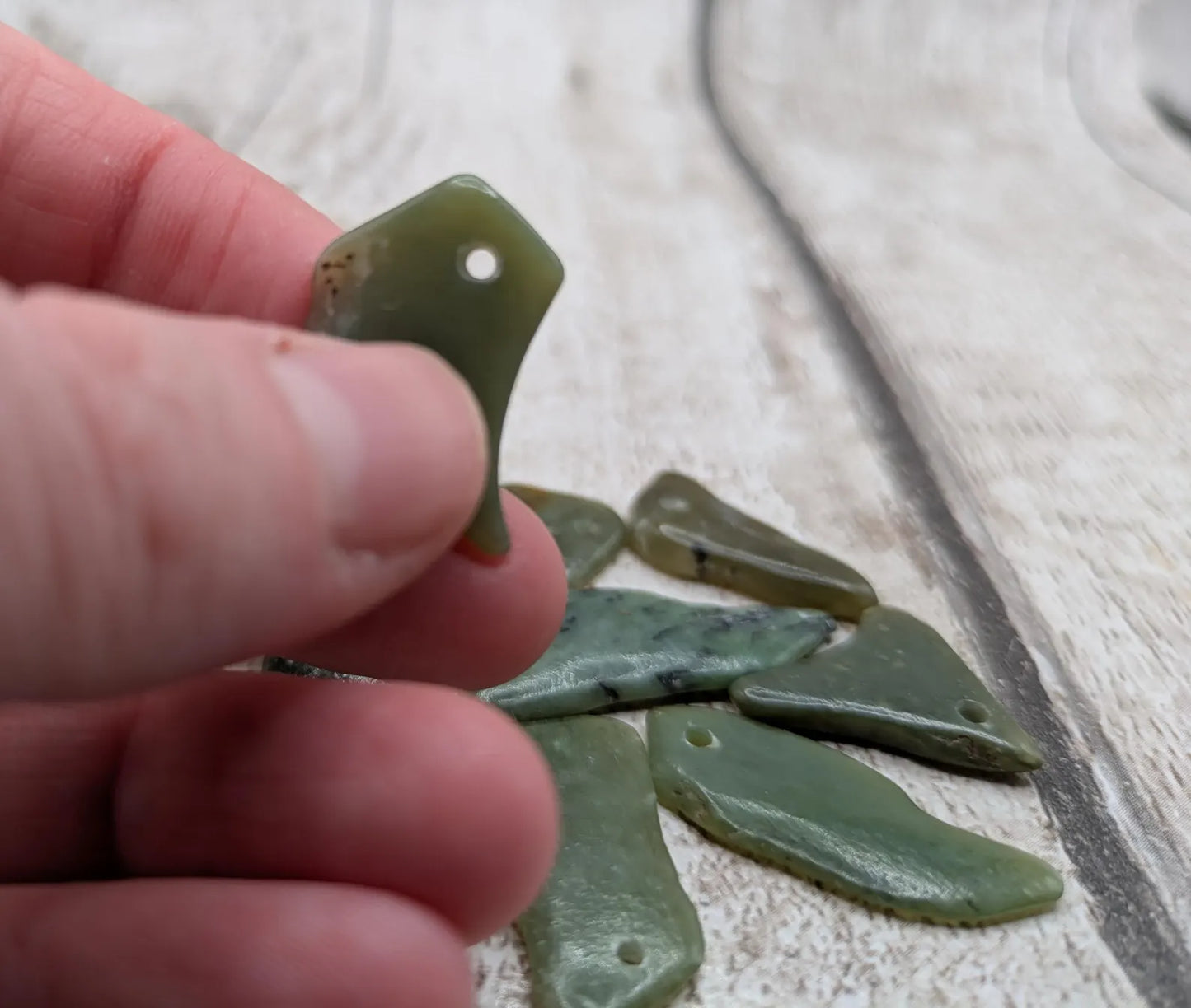 10 top drilled tumbled greenstone jade beads.