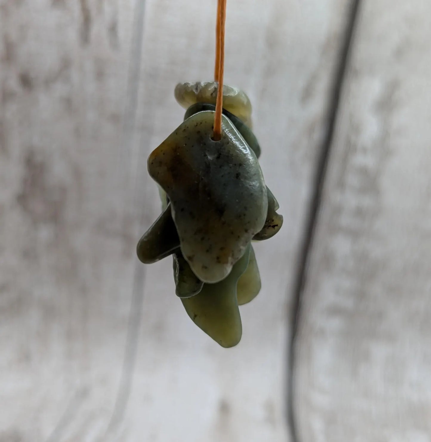 10 top drilled tumbled greenstone jade beads.