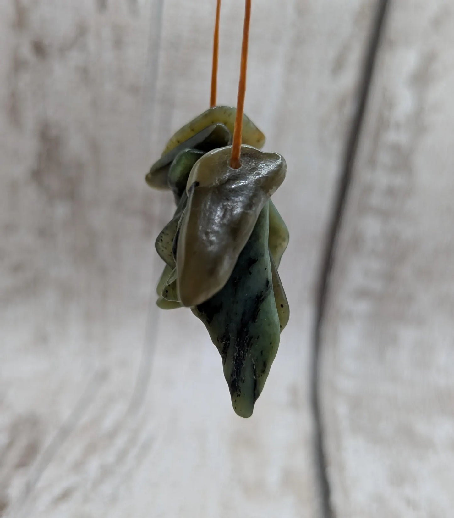 10 top drilled tumbled greenstone jade beads.