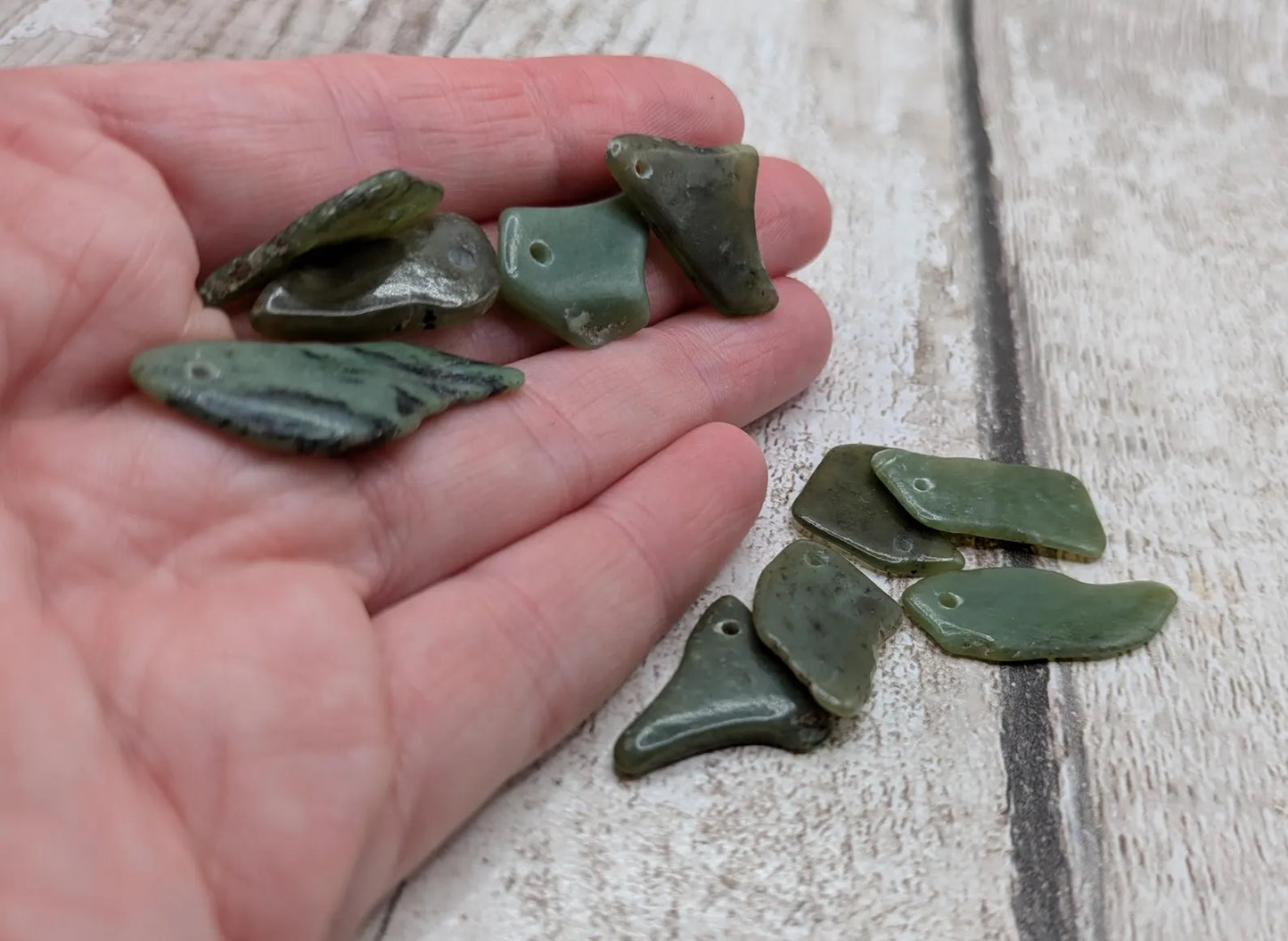 10 top drilled tumbled greenstone jade beads.