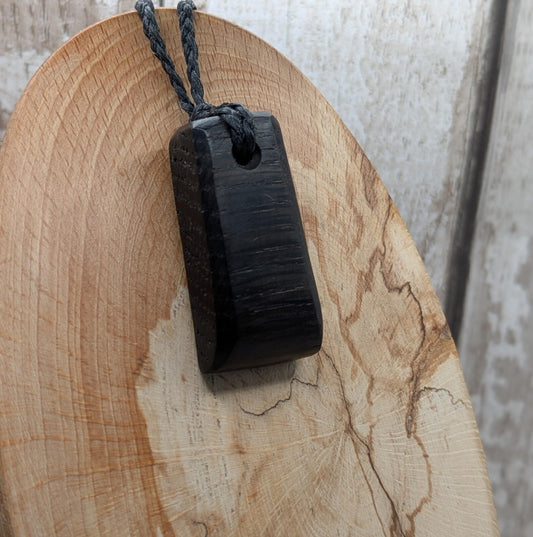 Fenland bog oak hei toki adze styled pendant.