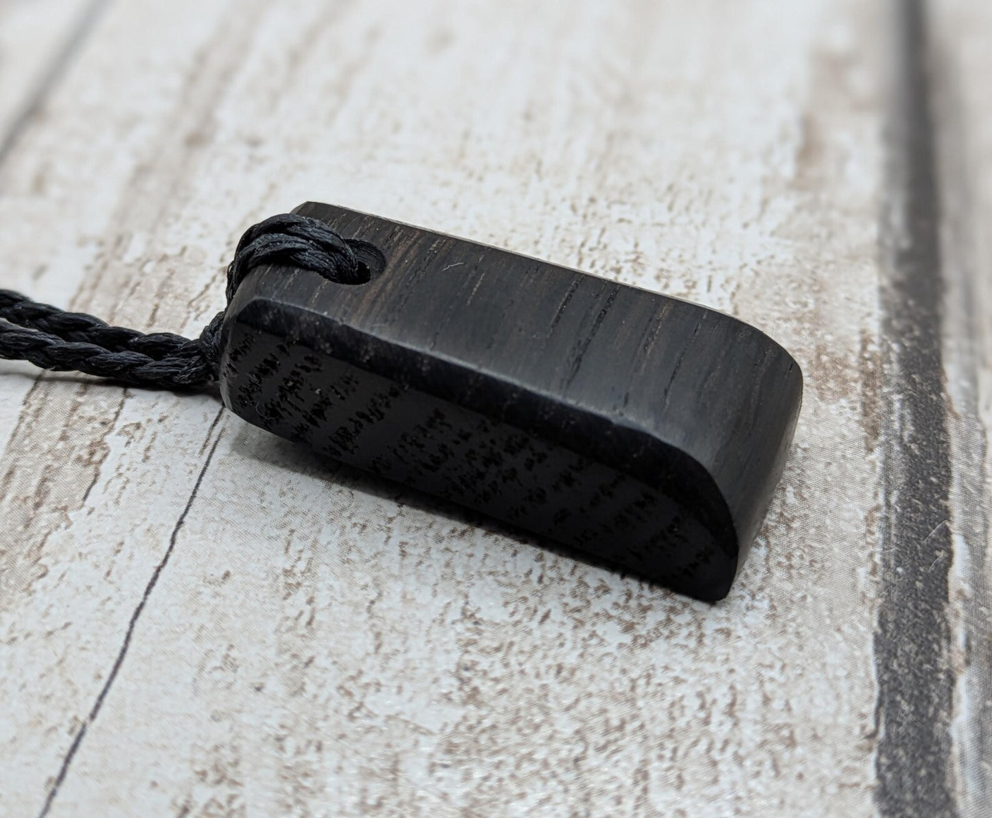 Fenland bog oak hei toki adze styled pendant.
