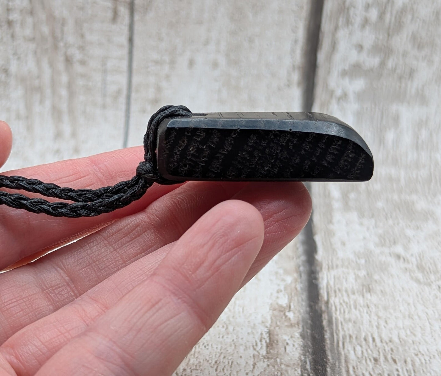 Fenland bog oak hei toki adze styled pendant.