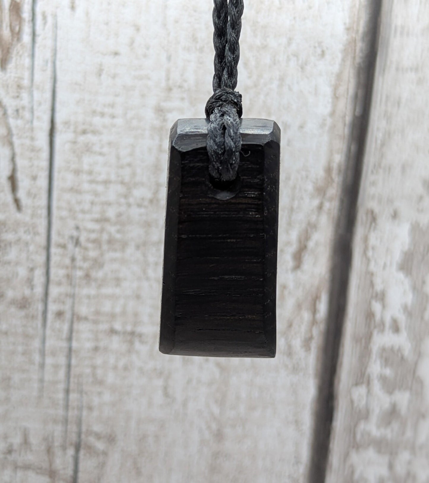 Fenland bog oak hei toki adze styled pendant.