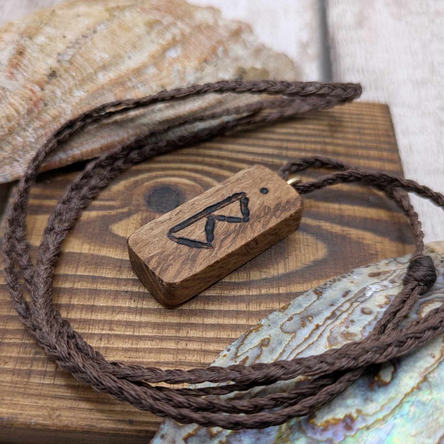 Olive wood berkana rune pendant.