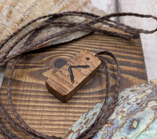 Olive wood kenaz rune pendant.