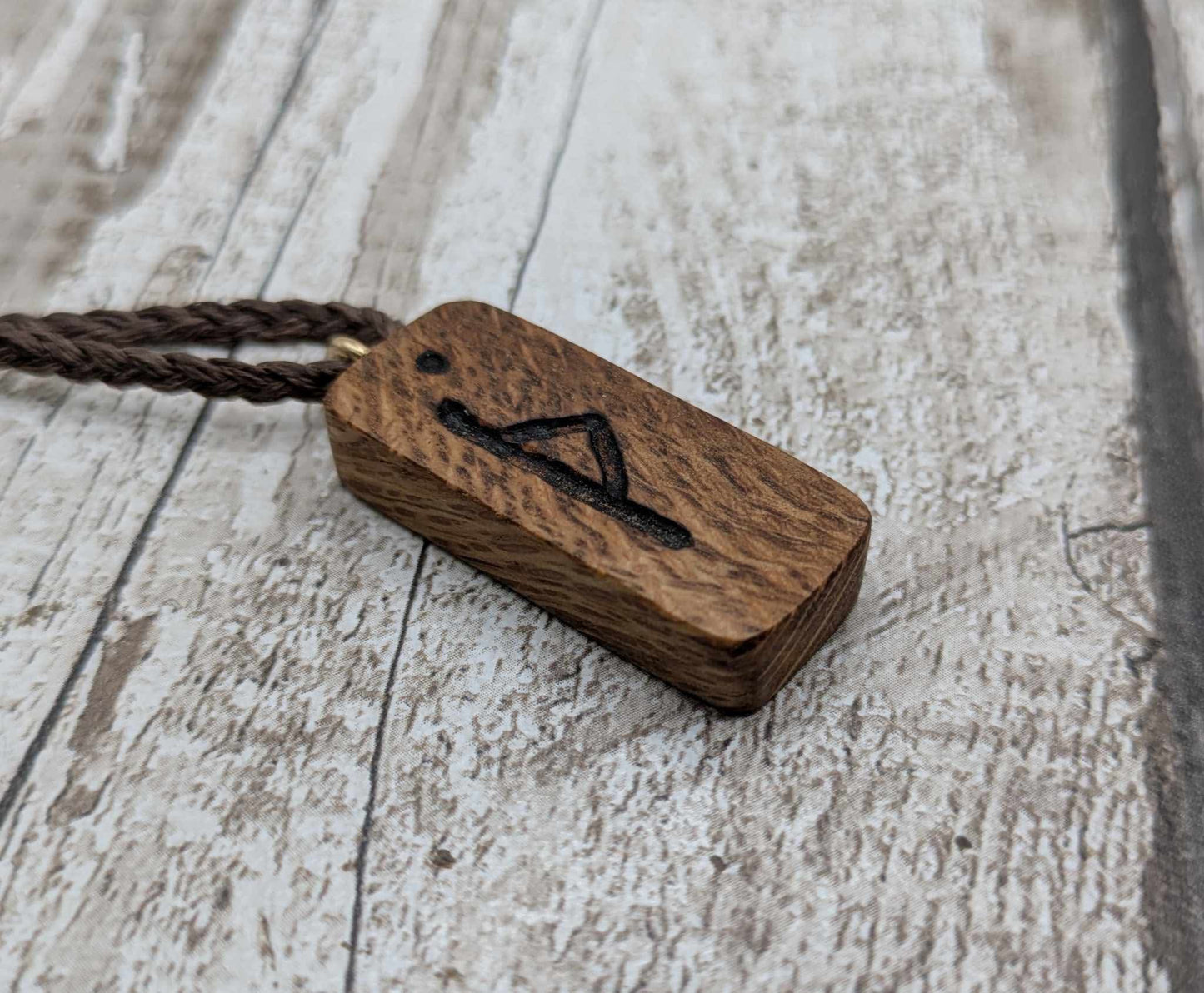 Olive wood thurisaz rune pendant.
