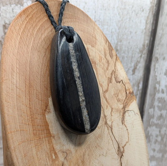 Fenland bog oak wood oval pendant with Avebury Sarsen central inlay.