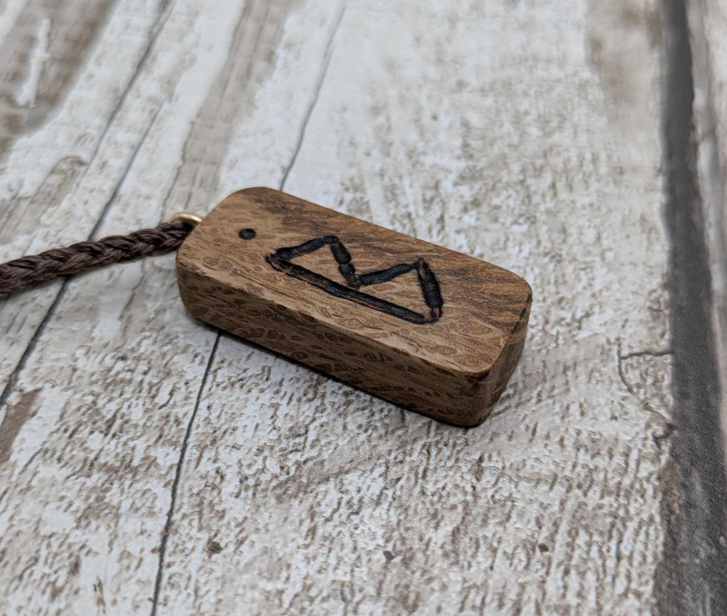 Olive wood berkana rune pendant.