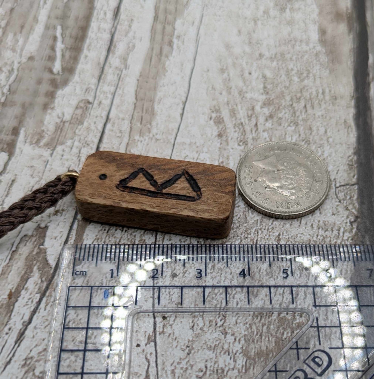 Olive wood berkana rune pendant.