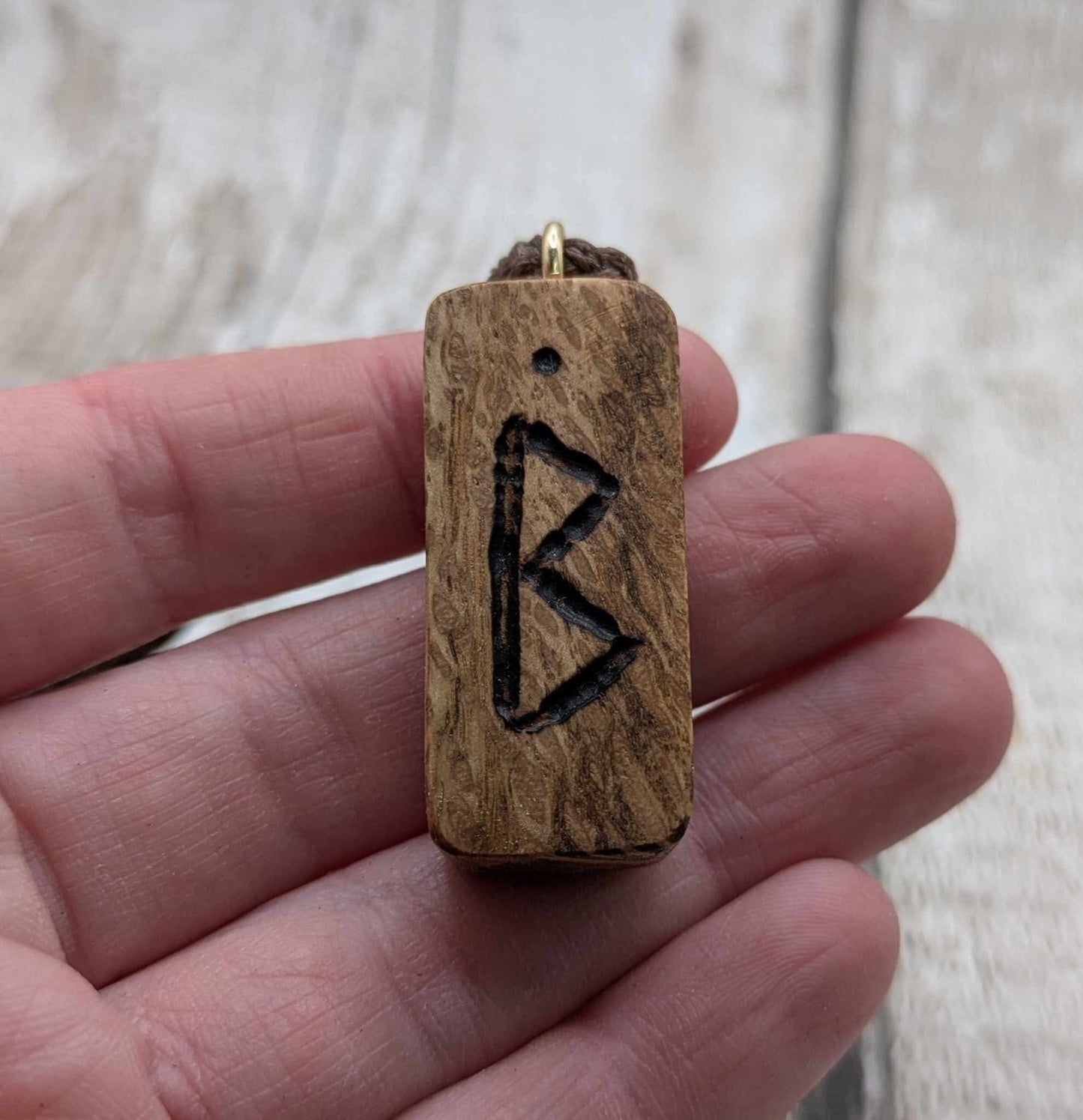 Olive wood berkana rune pendant.