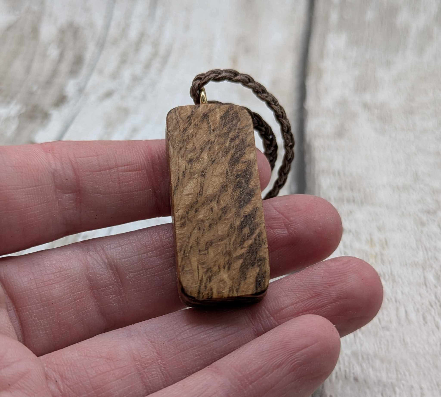 Olive wood berkana rune pendant.