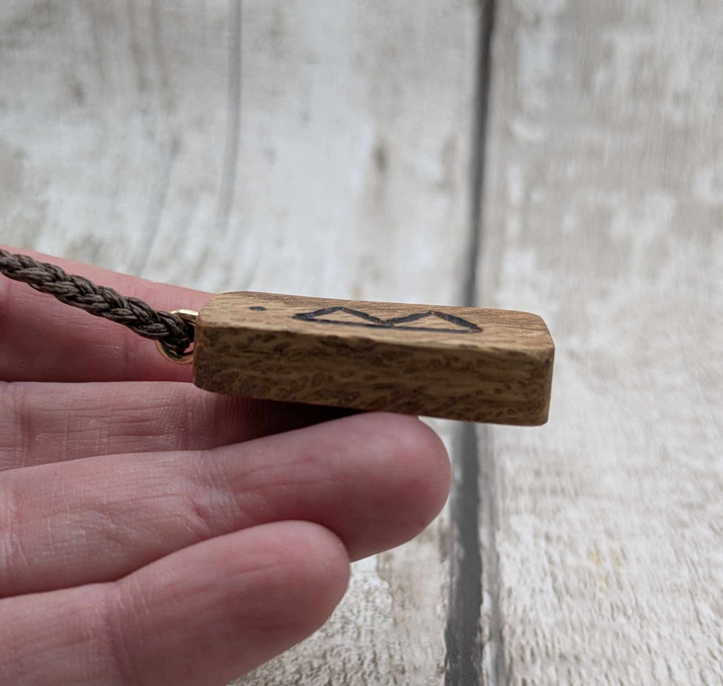 Olive wood berkana rune pendant.