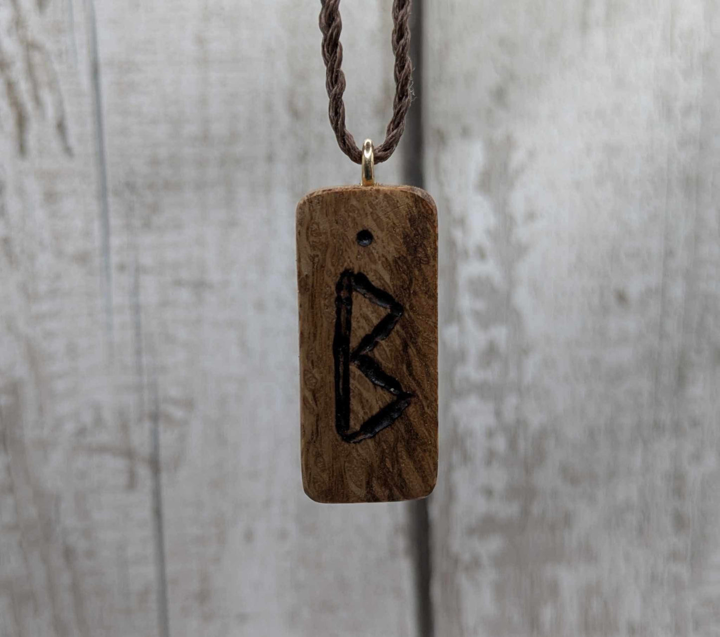 Olive wood berkana rune pendant.